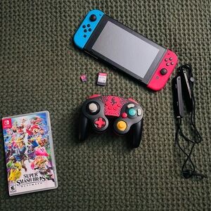 Nintendo Switch Console with Red & Blue Joy-Cons and Black Pro-Style Controller
